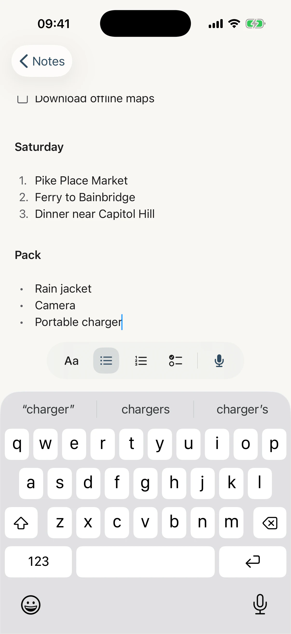 The As Told writing toolbar floating above the iPhone keyboard: an Aa style button, then bulleted list, numbered list and checklist buttons with the bulleted one highlighted, a divider, and a microphone.